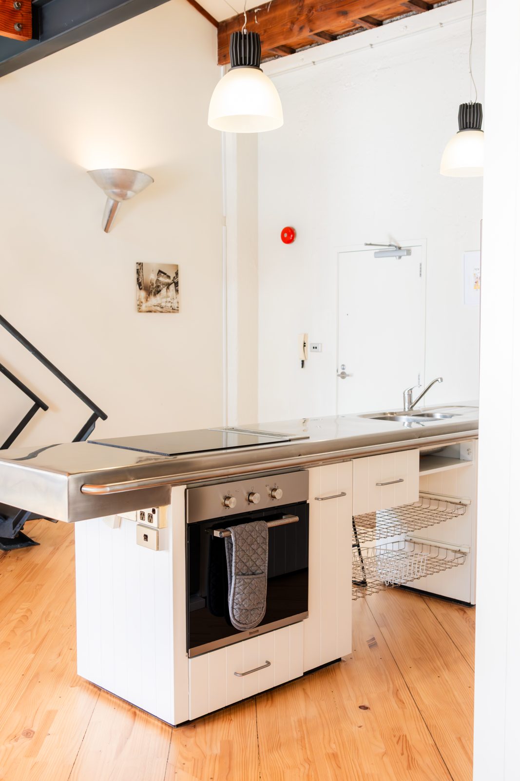 A corner of the kitchen beside the steel staircase