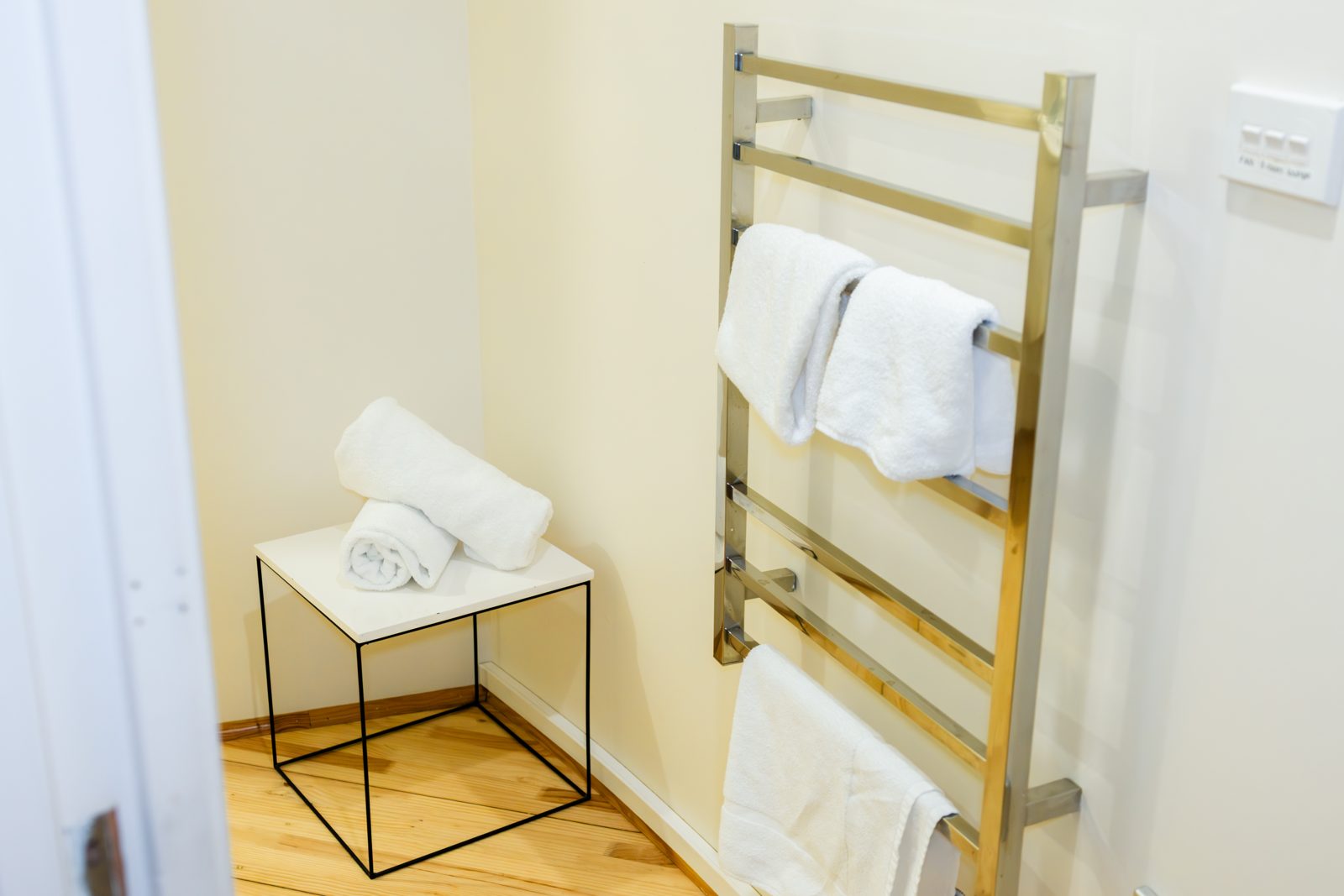 The bathroom with heated towel rail and walk-in shower