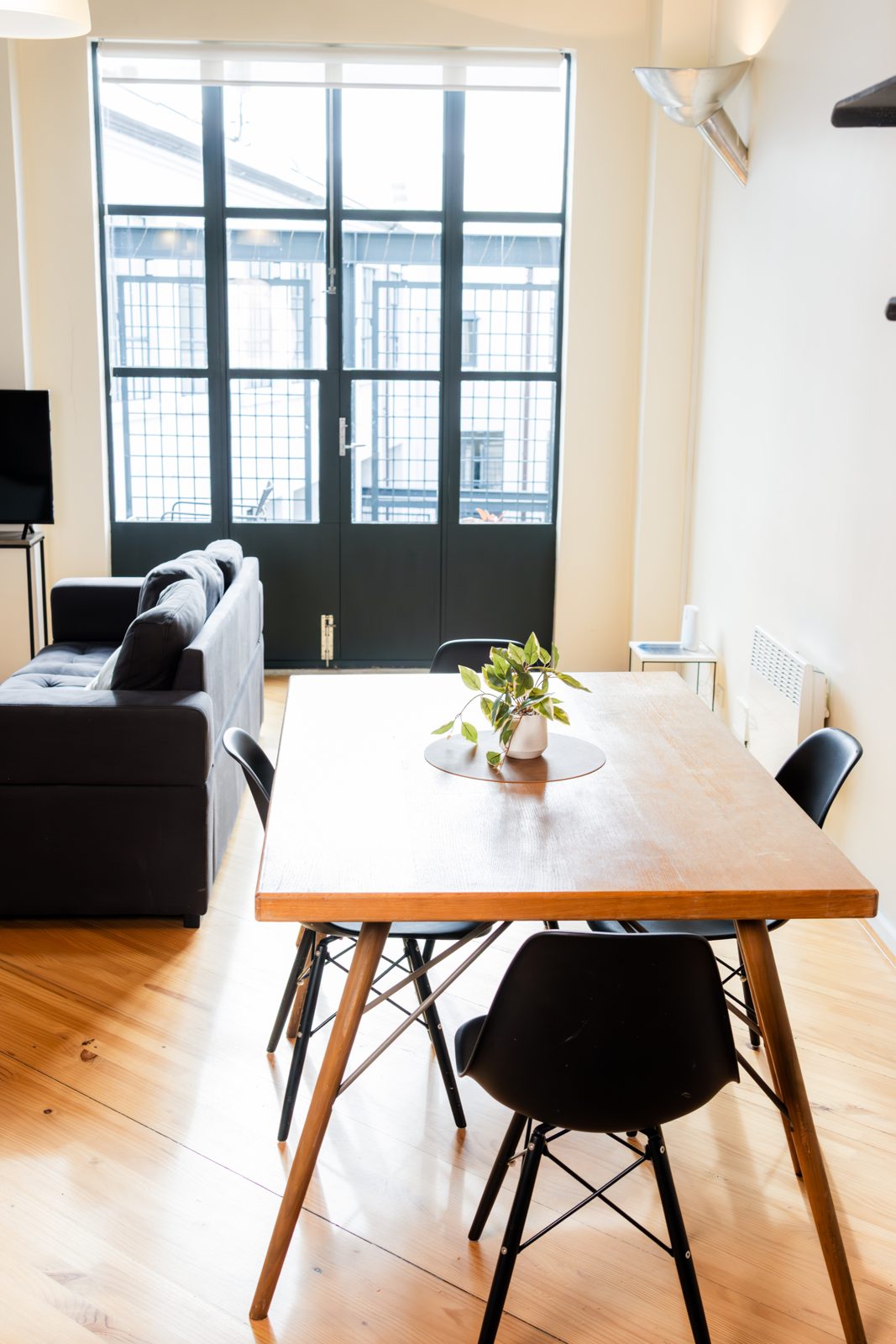 The dining table and chairs by the windows
