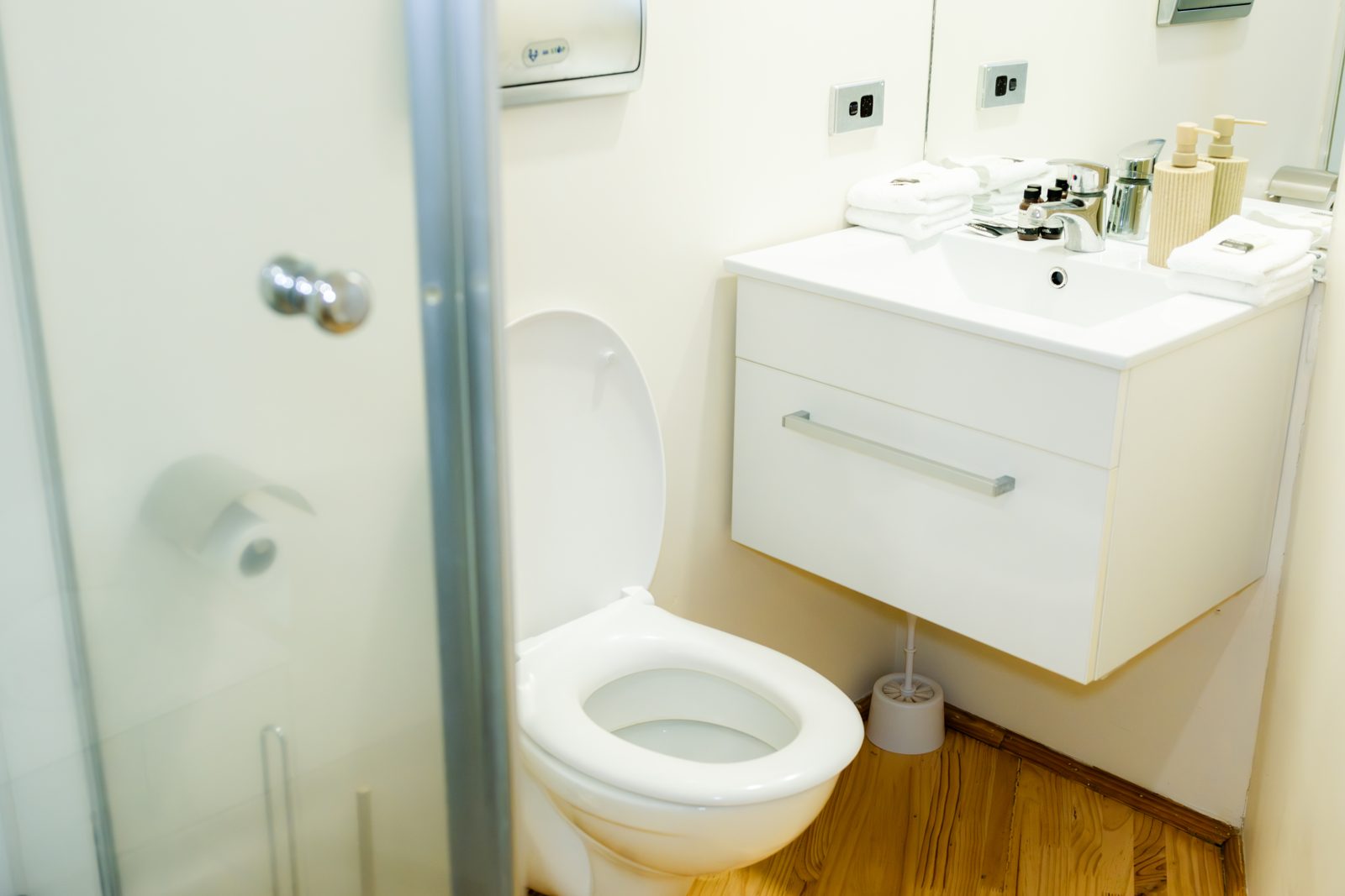 The bathroom with vanity, basin and toilet